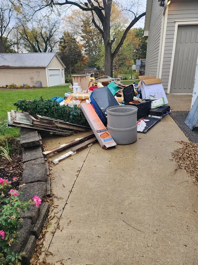 Dumpster being loaded with debris for Commercial Dumpster Rental in Ketchum